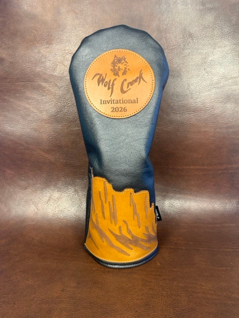 Wolf Creek Invitational 2026 tournament cover in navy leather with a tan canyon cuff and engraved patch